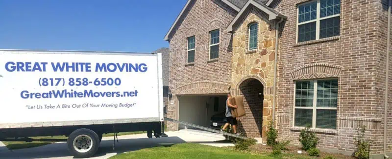 A Great White Moving Company truck arrives at the destination home.