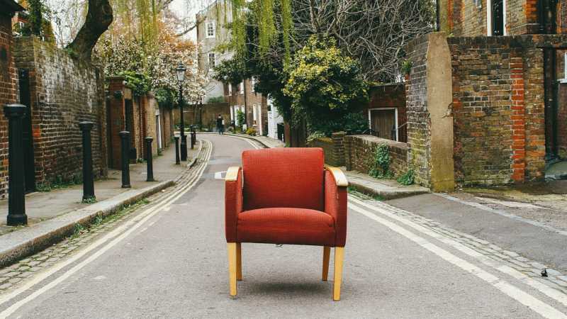 Orange chair standing in street