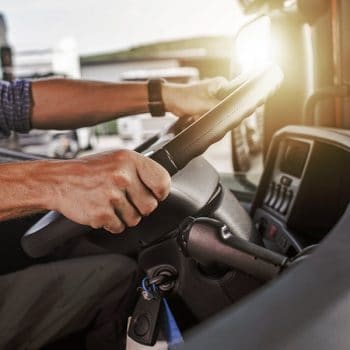 Man driving towing truck