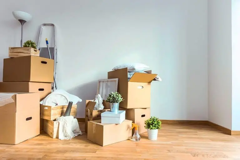 Moving boxes overflowing with too many household objects