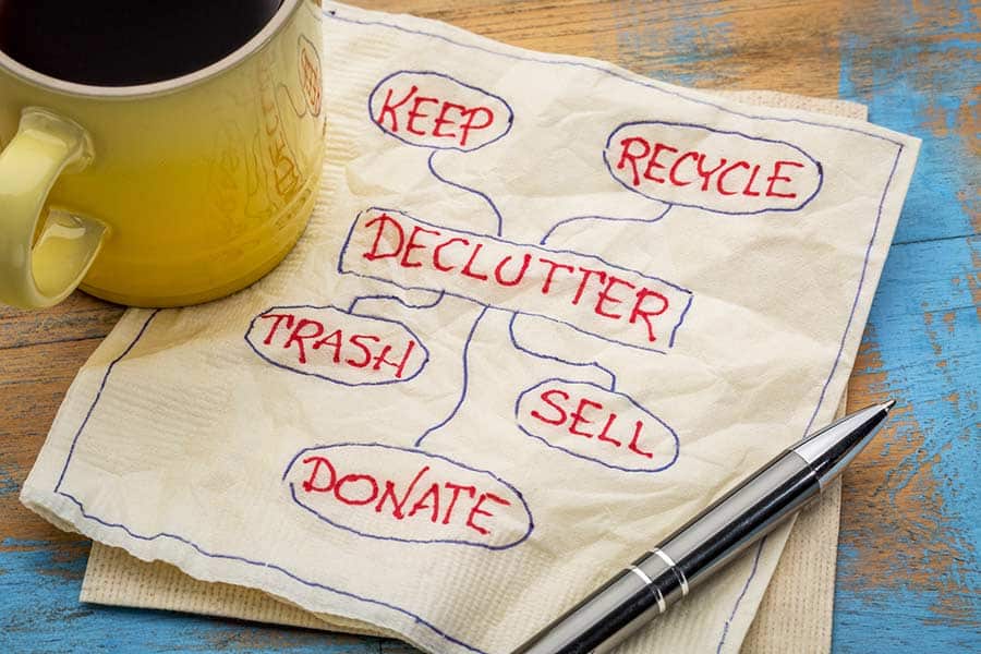Napkin with the words "declutter, keep, recycle, trash, sell, donate"