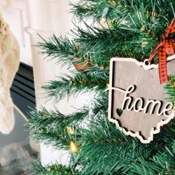 Christmas tree with an ornament with the text "Home"