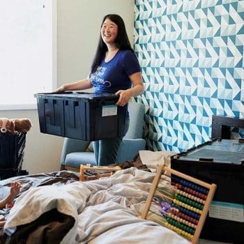 Mom packing clothes with her son