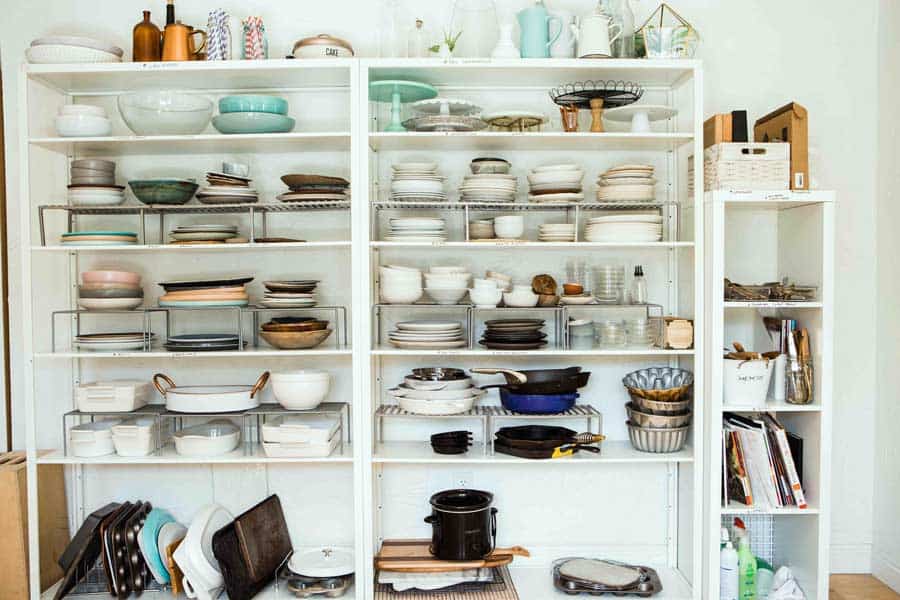 Shelves full of old kitchen items and other clutter