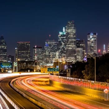 Dallas Relocation Guide Banner: The Dallas skyline at night.