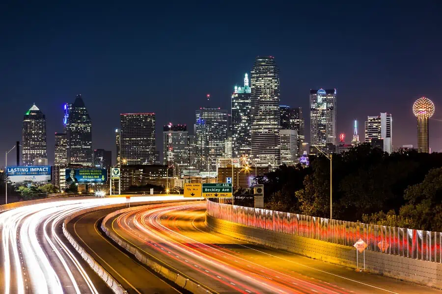 Dallas Relocation Guide Banner: The Dallas skyline at night.