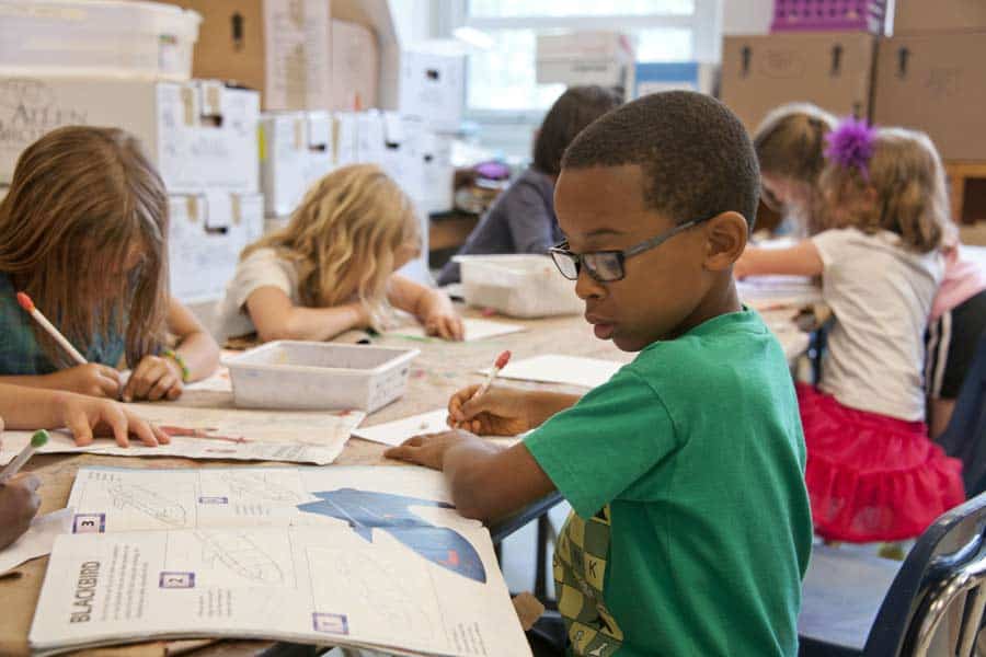 Elementary school children working on a class assignment
