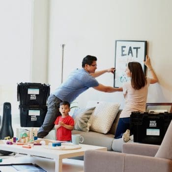 parents with their kid moving into house