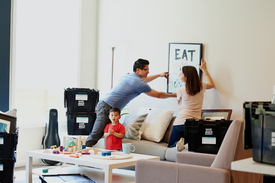 parents with their kid moving into house