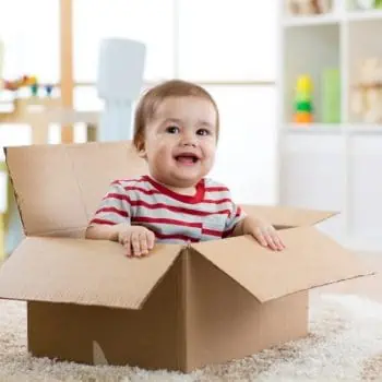 baby in cardboard box after moving