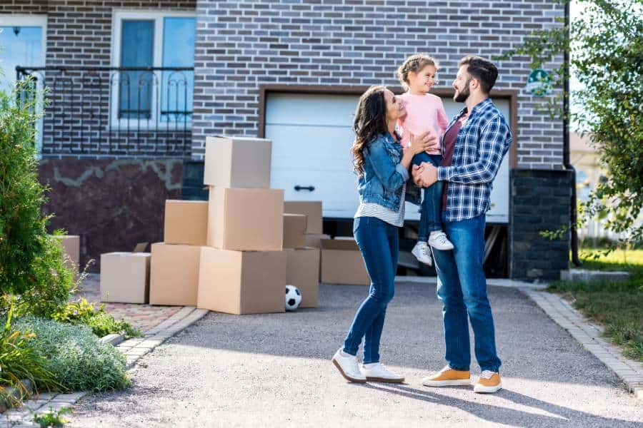 family just arriving at their new home