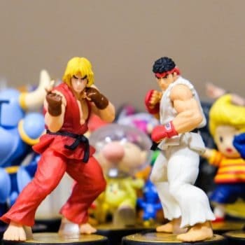 action figures posed in front of one another with ryu and ken at the front