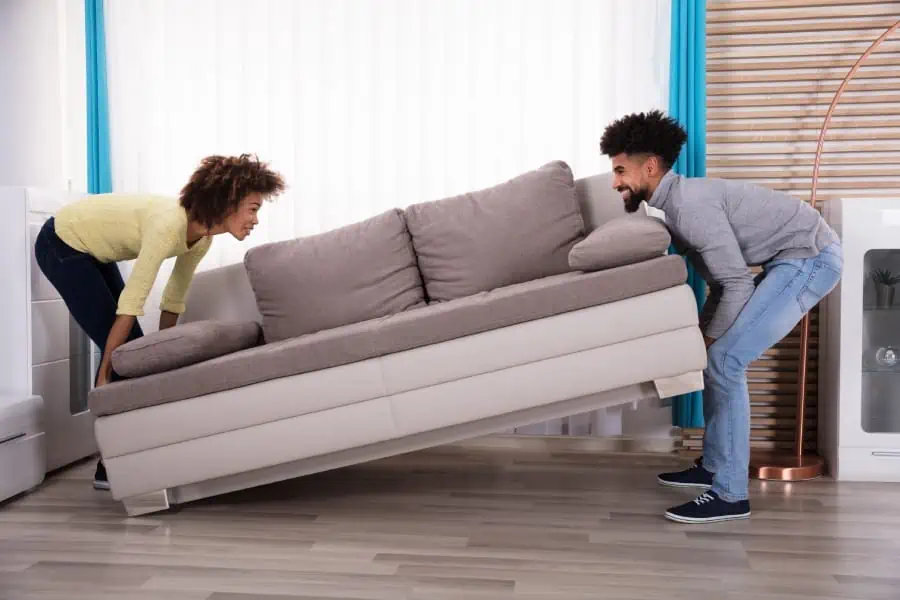 young friends moving couch