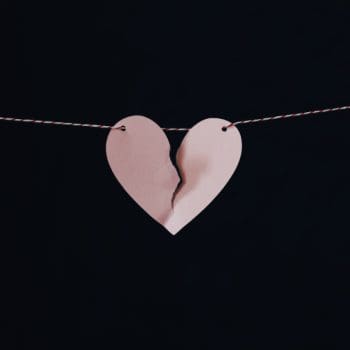 Broken paper heart on a string