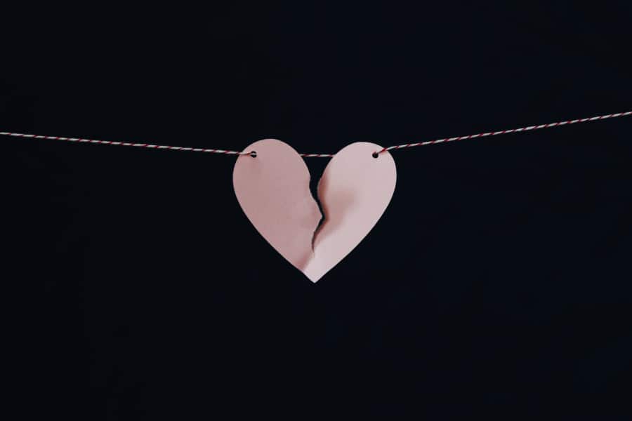 Broken paper heart on a string