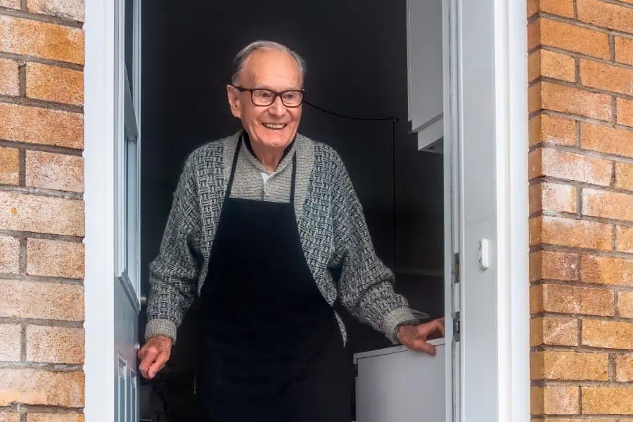 Happy elderly man getting ready to move out